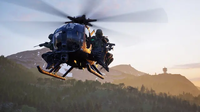 A light attack helicopter with door gunners banks over the Kolchia mountains at sunset