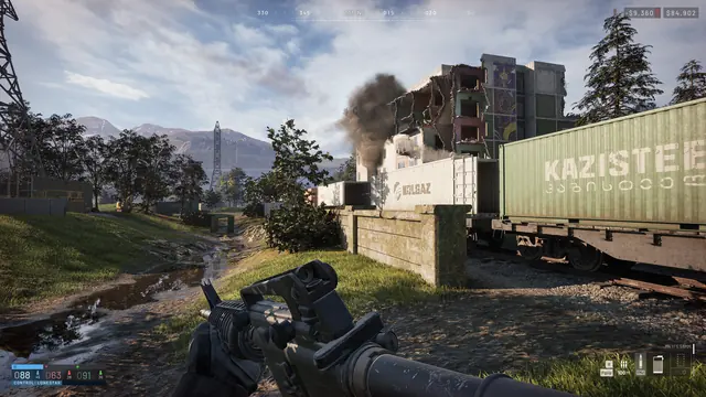 First-person view through smoke beside stacked shipping containers in an industrial yard