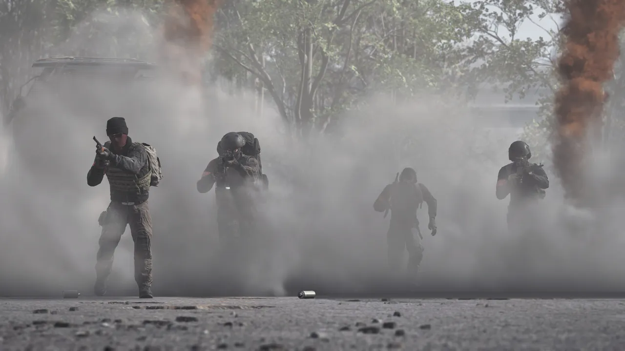 Four soldiers advance in line through a wall of dust and smoke