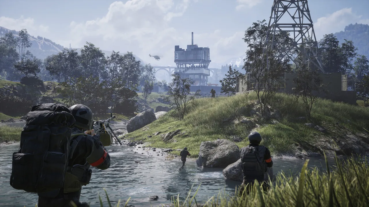 Two players wade a river toward a tall industrial structure